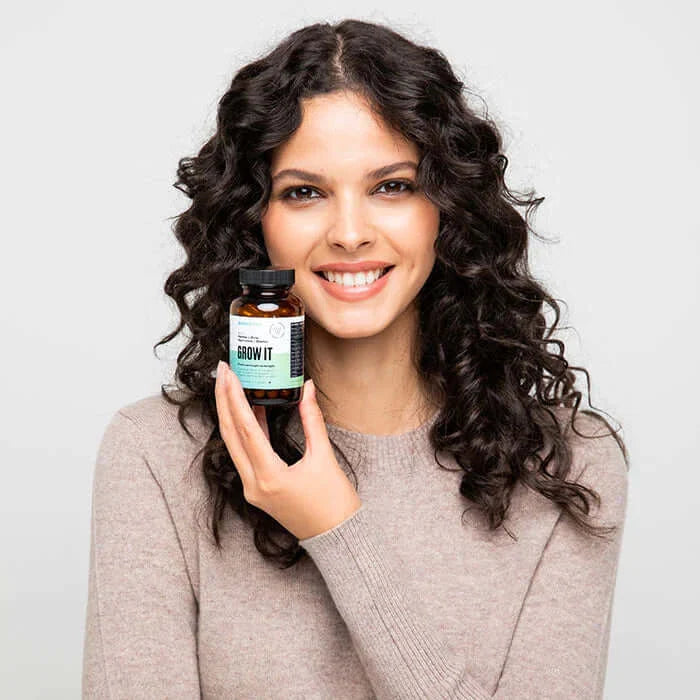 ANNUTRI - Grow it supplements , girl holding grow it tablets 