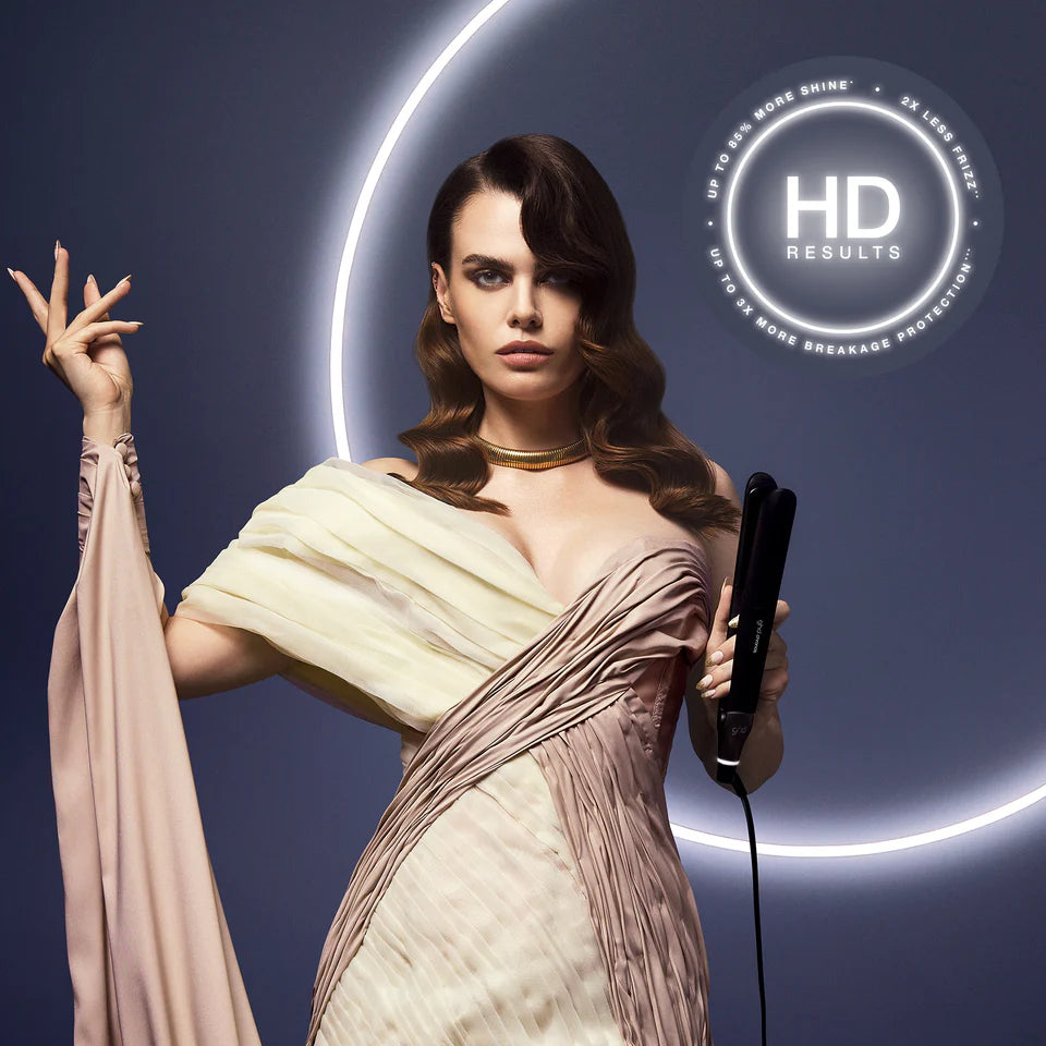 Woman holding a hair straightener with 'HD Results' logo in the background