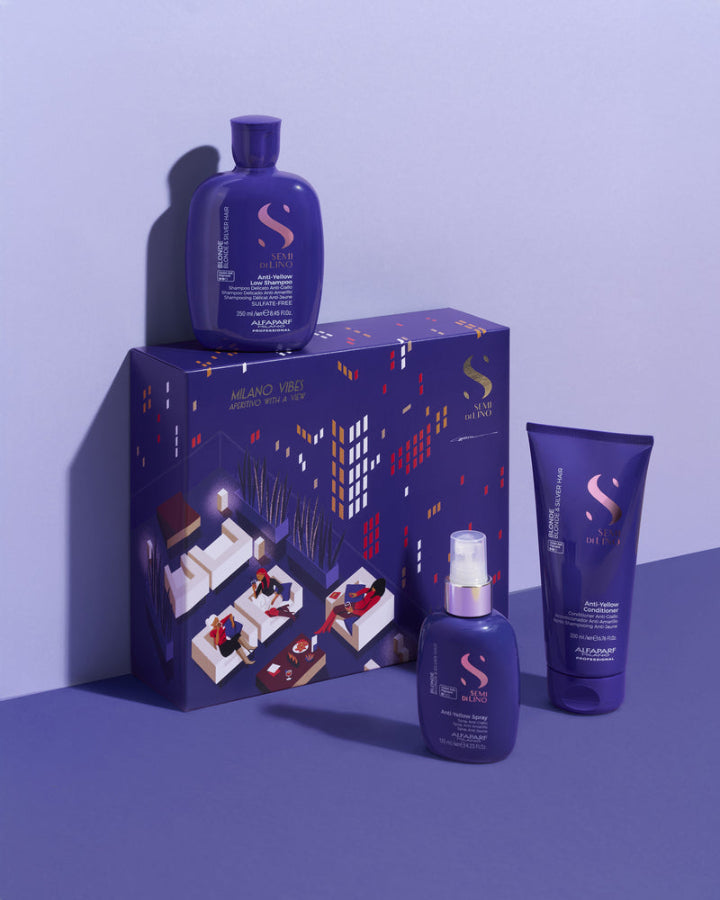 Purple skincare product set with packaging on a matching purple background - Alfaparf Semi Di Lino Blonde Christmas Gift Set 2025