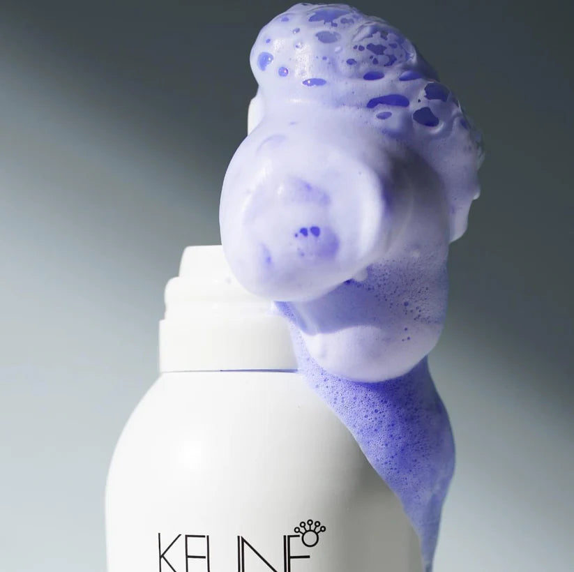 White bottle with a purple foam head on a gray background, featuring the brand 'KELINE'.