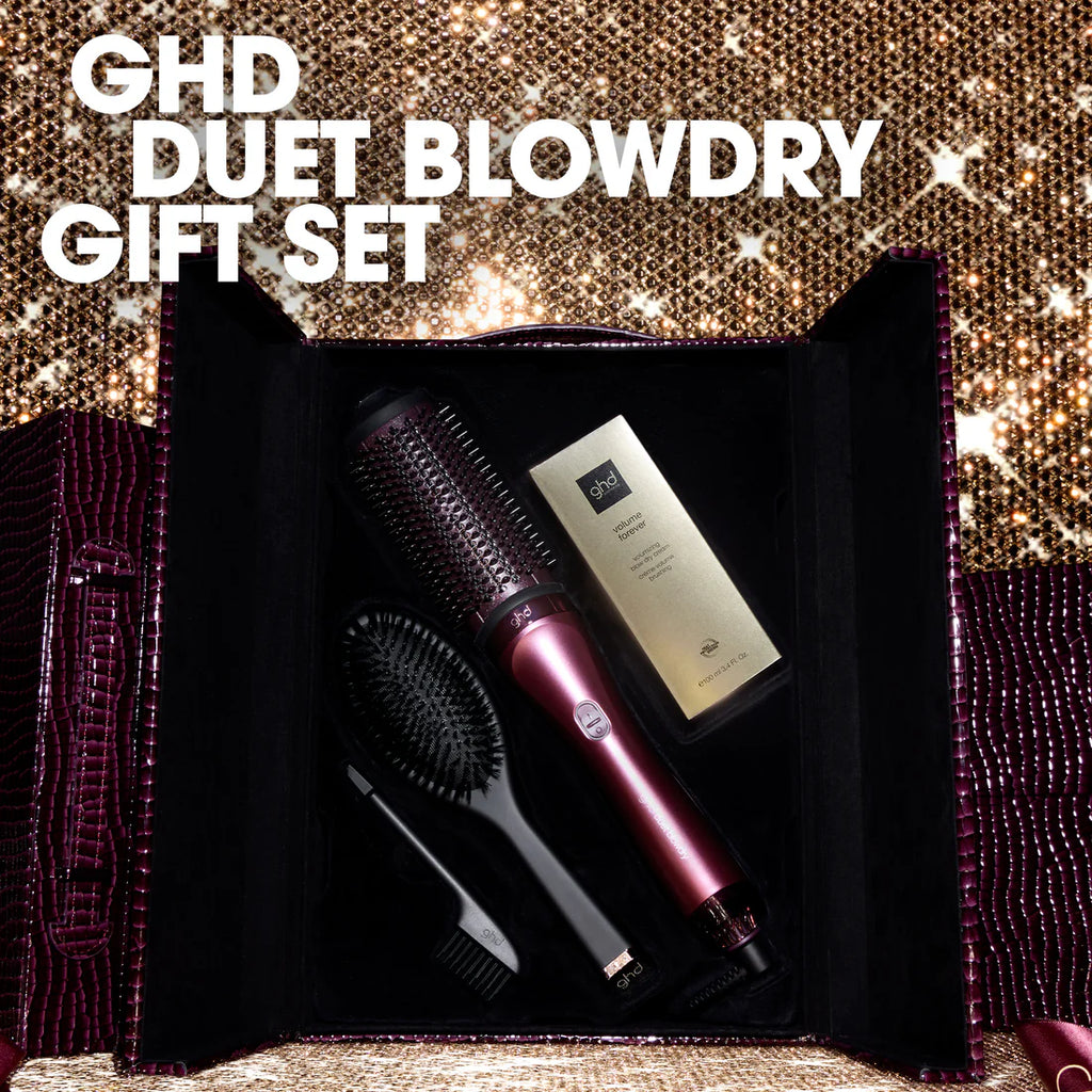 GHD Duet Blowdry gift set with hairbrush and bottle on a glittery background